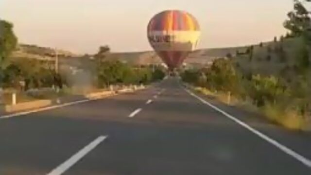 Hot air balloon in the middle of the road looks like a reenactment of the auto-refractor test we do at the eye doctor.