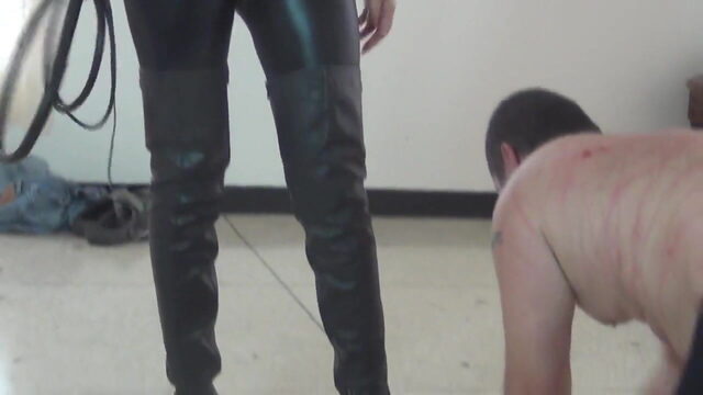 Goddess in latex boots whipping